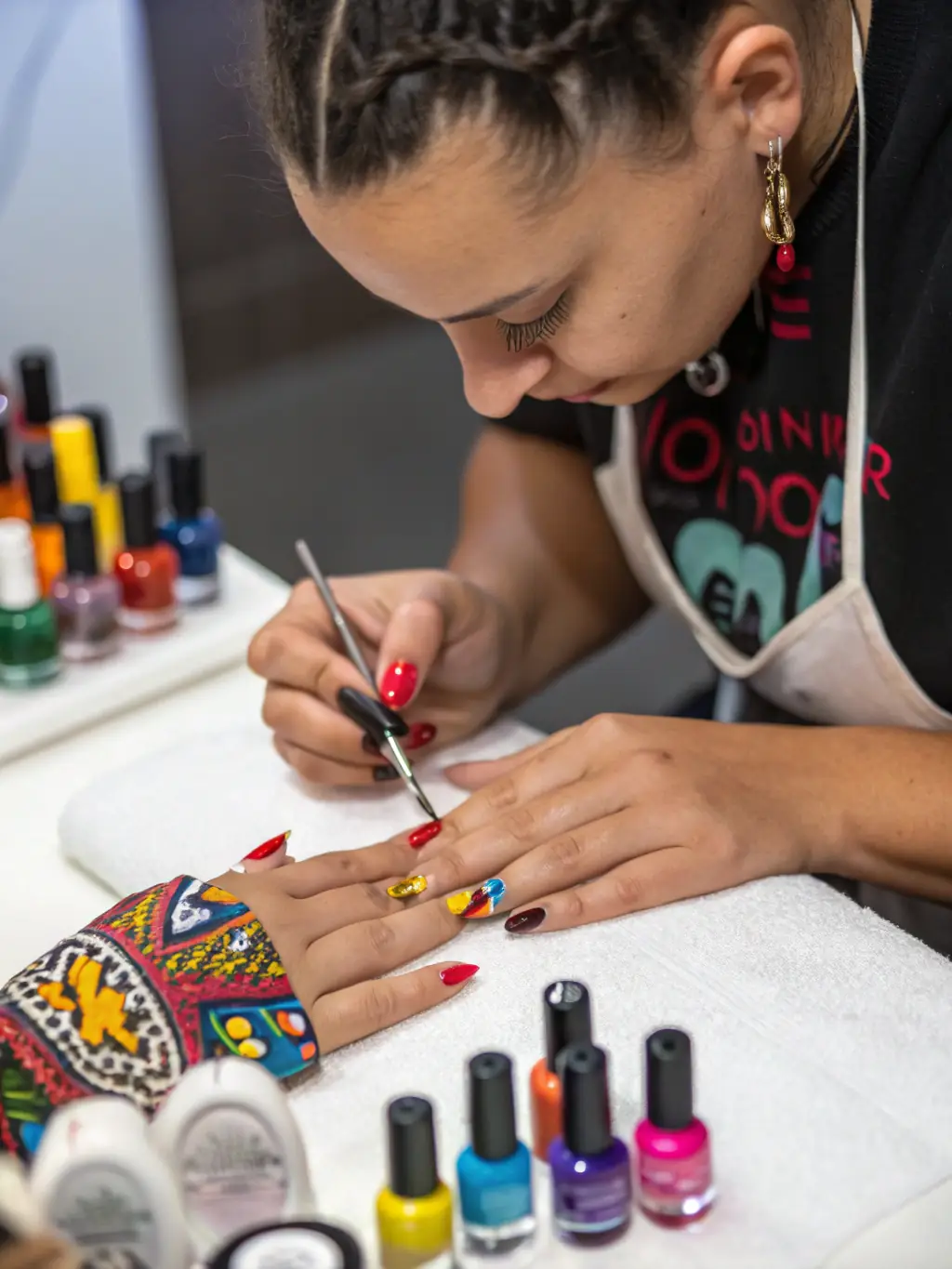 A nail technician meticulously applying intricate nail art to a client's nails, highlighting the salon's attention to detail and creative nail care services.